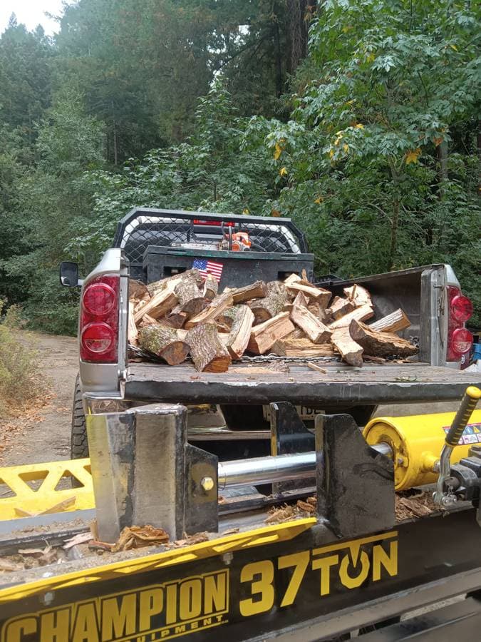 pickup truck full of chopped wood